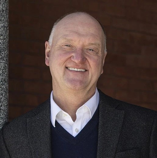 Headshot of Dean Andrew Karolyi.